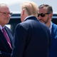 Then President Donald Trump greets El Paso Mayor Dee Margo, left, and Senator Ted Cruz, right, as he disembarks from Air Force One upon arrival at El Paso International Airport in El Paso, Texas, August 7, 2019.